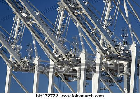 Shipping cranes under blue sky View Large Photo Image Stock Image - Shipping cranes under blue sky. Fotosearch