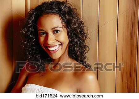 Picture - Smiling woman relaxing in sauna. Fotosearch