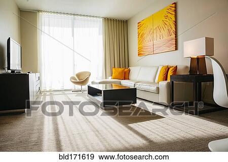 Stock Photo - Sofa, coffee table and television in modern living room. Fotosearch