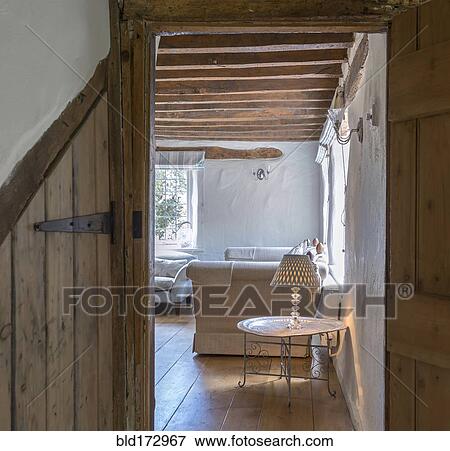 Stock Photo - Sofa, lamp and side table in living room. Fotosearch