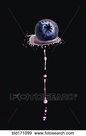 Stock Photo - Splashing liquid on blueberry. Fotosearch
