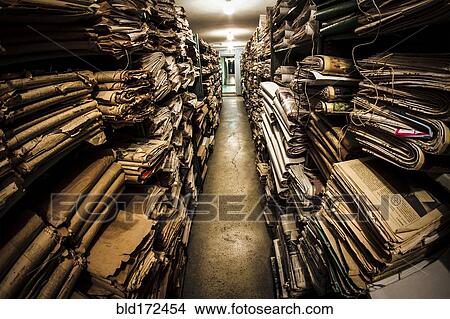 Stacks of old newspapers in library archive View Large Photo Image Picture - Stacks of old newspapers in library archive. Fotosearch