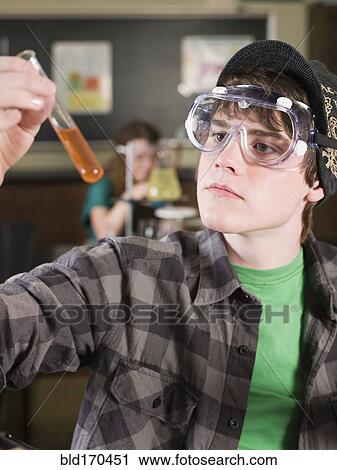 Student examining sample in science lab classroom View Large Photo Image Stock Image - Student examining sample in science lab classroom. Fotosearch