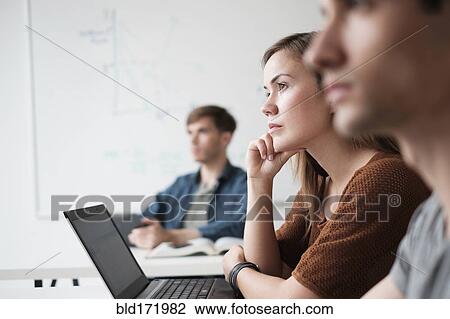 Student listening in college classroom View Large Photo Image Stock Image - Student listening in college classroom. Fotosearch