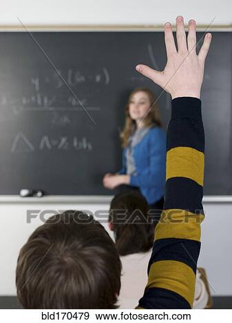 Student raising hand in classroom View Large Photo Image Stock Photo - Student raising hand in classroom. Fotosearch