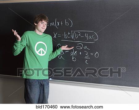 Student shrugging in confusion at chalkboard in classroom View Large Photo Image Stock Image - Student shrugging in confusion at chalkboard in classroom. Fotosearch