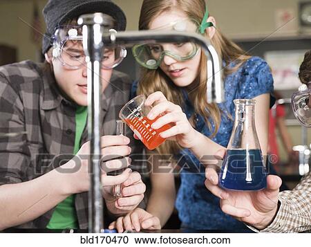 Students performing experiment in science lab classroom View Large Photo Image Stock Image - Students performing experiment in science lab classroom. Fotosearch