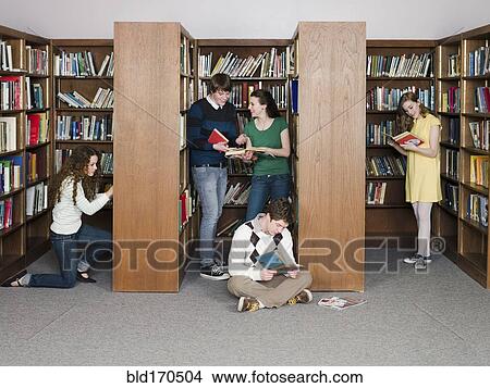 Students reading books in library View Large Photo Image Picture - Students reading books in library. Fotosearch