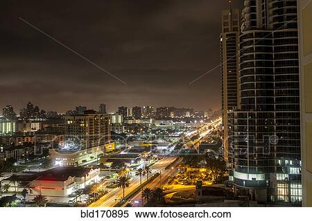 Stock Photography - Sunny Isles Beach cityscape at night, Florida, United States. Fotosearch