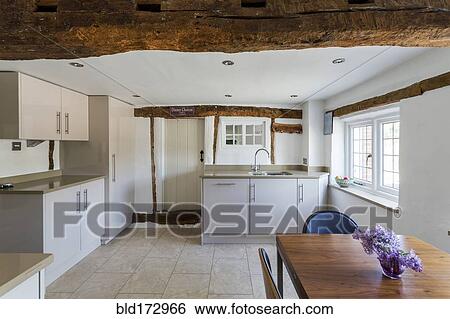 Stock Photograph - Table and chairs in modern kitchen. Fotosearch