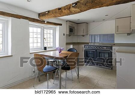 Stock Photography - Table and chairs in modern kitchen. Fotosearch