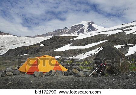 Stock Image - Tent at campsite in remote landscape. Fotosearch