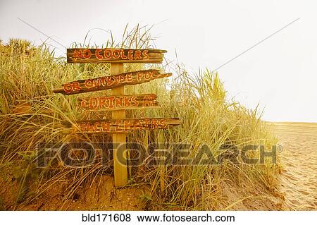 Stock Photo - Tourist signs for beach in grass. Fotosearch