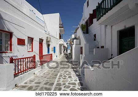 Traditional buildings on Mykonos street, Cyclades Islands, Greece View Large Photo Image Stock Photography - Traditional buildings on Mykonos street, Cyclades Islands, Greece. Fotosearch