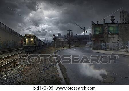 Stock Photo - Train on train tracks in dilapidated industrial city. Fotosearch