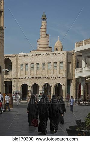 Women in hijab walking in Doha square, Doha, Qatar View Large Photo Image Stock Image - Women in hijab walking in Doha square, Doha, Qatar. Fotosearch