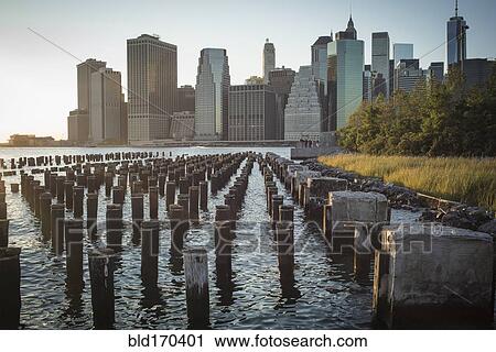Wooden posts at waterfront, New York, United States View Large Photo Image Stock Image - Wooden posts at waterfront, New York, United States. Fotosearch