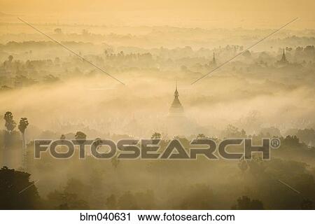 Aerial view of towers in misty landscape View Large Photo Image Stock Image - Aerial view of towers in misty landscape. Fotosearch