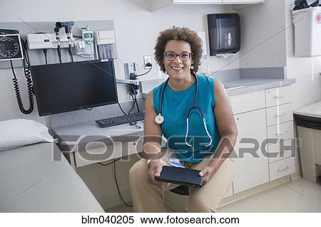 African American doctor holding digital tablet View Large Photo Image Stock Photography - African American doctor holding digital tablet. Fotosearch