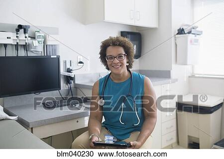African American doctor using digital tablet View Large Photo Image Stock Image - African American doctor using digital tablet. Fotosearch