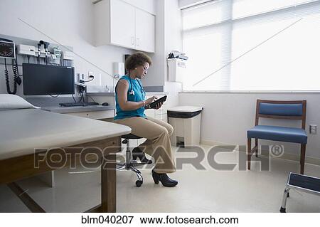 African American doctor using digital tablet View Large Photo Image Stock Photo - African American doctor using digital tablet. Fotosearch
