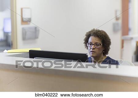 African American nurse using computer in hospital View Large Photo Image Stock Image - African American nurse using computer in hospital. Fotosearch