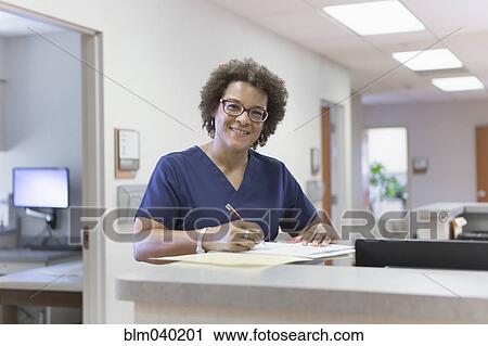African American nurse writing in hospital View Large Photo Image Stock Image - African American nurse writing in hospital. Fotosearch