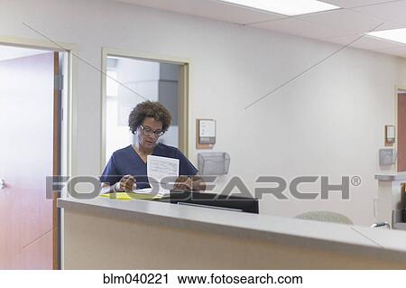 African American nurse writing in hospital View Large Photo Image Stock Image - African American nurse writing in hospital. Fotosearch