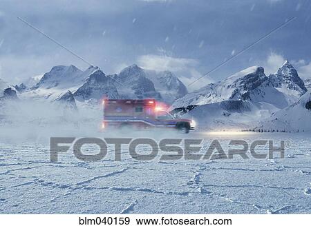 Ambulance driving in snowy remote landscape View Large Photo Image Stock Photo - Ambulance driving in snowy remote landscape. Fotosearch