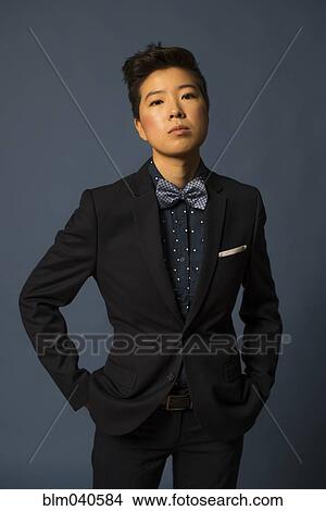 Androgynous woman wearing suit View Large Photo Image Picture - Androgynous woman wearing suit. Fotosearch