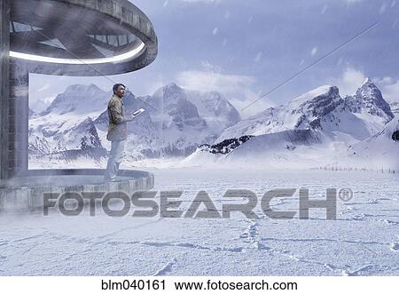Asian man standing on patio in snow View Large Photo Image Stock Image - Asian man standing on patio in snow. Fotosearch