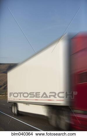 Blurred view of truck driving on highway View Large Photo Image Picture - Blurred view of truck driving on highway. Fotosearch