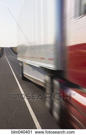 Blurred view of truck driving on remote highway View Large Photo Image Stock Image - Blurred view of truck driving on remote highway. Fotosearch