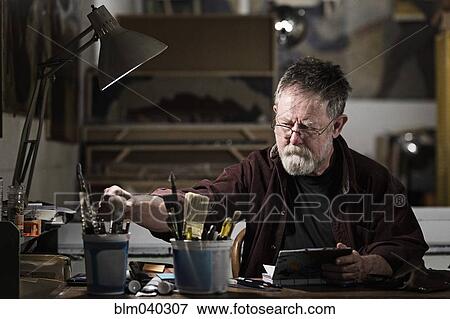 Caucasian artist drawing in studio View Large Photo Image Stock Photo - Caucasian artist drawing in studio. Fotosearch
