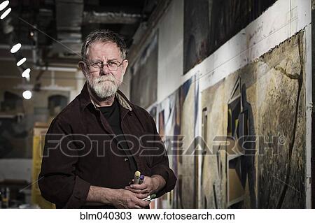 Stock Image - Caucasian artist in studio. Fotosearch