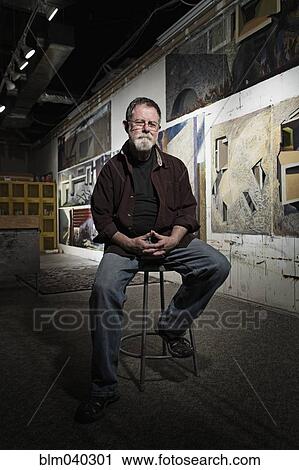 Caucasian artist sitting in studio View Large Photo Image Stock Image - Caucasian artist sitting in studio. Fotosearch