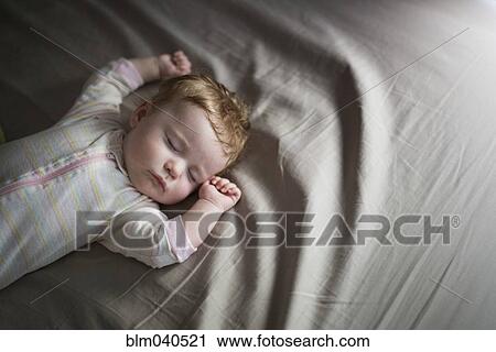Caucasian baby girl sleeping on bed View Large Photo Image Stock Image - Caucasian baby girl sleeping on bed. Fotosearch