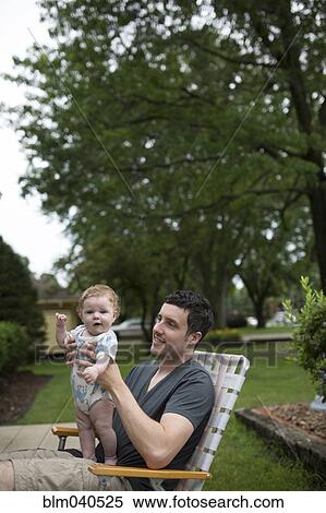 Caucasian father and daughter in backyard View Large Photo Image Stock Photography - Caucasian father and daughter in backyard. Fotosearch