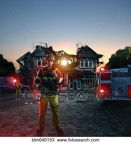 Caucasian firefighter at burned house View Large Photo Image Stock Image - Caucasian firefighter at burned house. Fotosearch