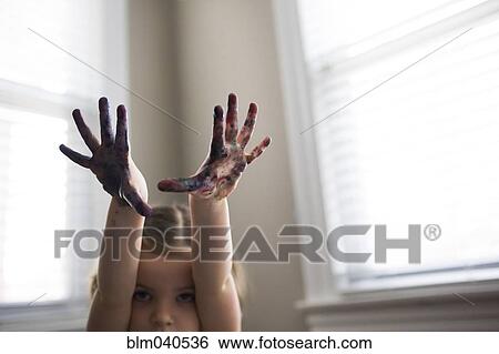 Stock Photograph - Caucasian girl finger painting. Fotosearch