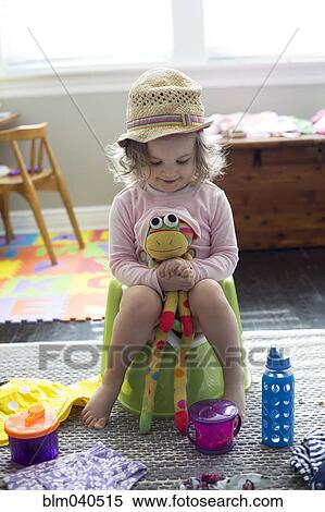 Caucasian girl playing with stuffed animal View Large Photo Image Stock Photography - Caucasian girl playing with stuffed animal. Fotosearch