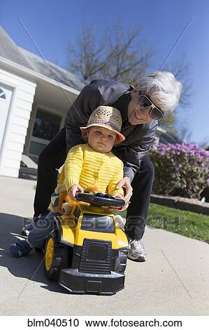 Caucasian grandmother and granddaughter playing View Large Photo Image Stock Image - Caucasian grandmother and granddaughter playing. Fotosearch