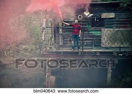 Caucasian man spraying pigment powder View Large Photo Image Stock Image - Caucasian man spraying pigment powder. Fotosearch
