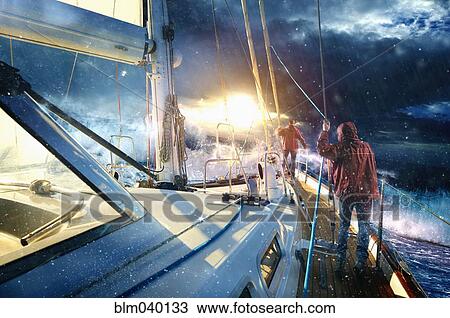 Caucasian sailors on yacht in stormy seas View Large Photo Image Stock Image - Caucasian sailors on yacht in stormy seas. Fotosearch