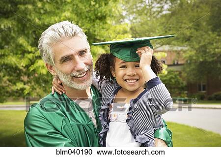 College graduate father holding daughter View Large Photo Image Stock Image - College graduate father holding daughter. Fotosearch