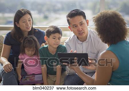 Doctor and patients using digital tablet View Large Photo Image Stock Photo - Doctor and patients using digital tablet. Fotosearch