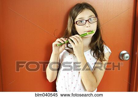 Stock Photography - Girl playing flute. Fotosearch