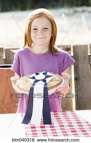 Girl winning pie baking contest View Large Photo Image Stock Photo - Girl winning pie baking contest. Fotosearch