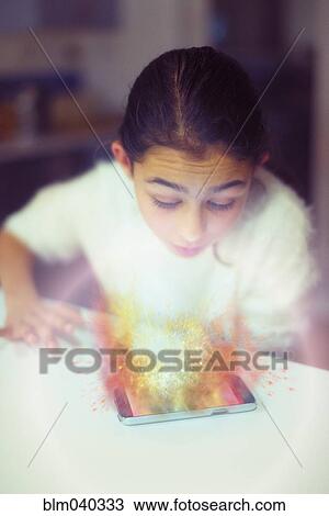 Mixed race girl examining hologram projection View Large Photo Image Stock Image - Mixed race girl examining hologram projection. Fotosearch