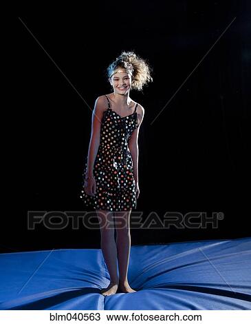 Mixed race girl standing on padding View Large Photo Image Stock Image - Mixed race girl standing on padding. Fotosearch